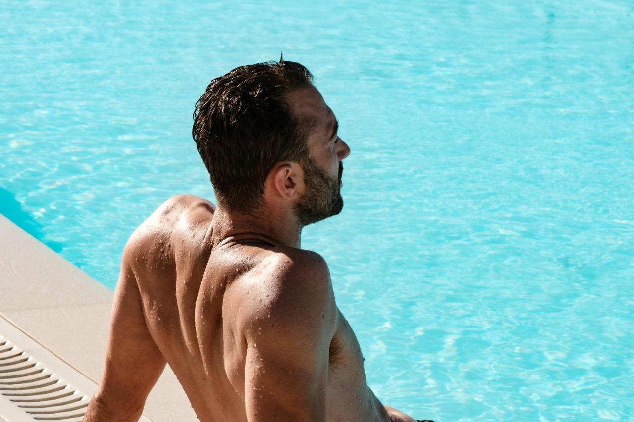 Hyatt Regency Malta Hotel Saint Julian's Exterior photo A man sunbathing