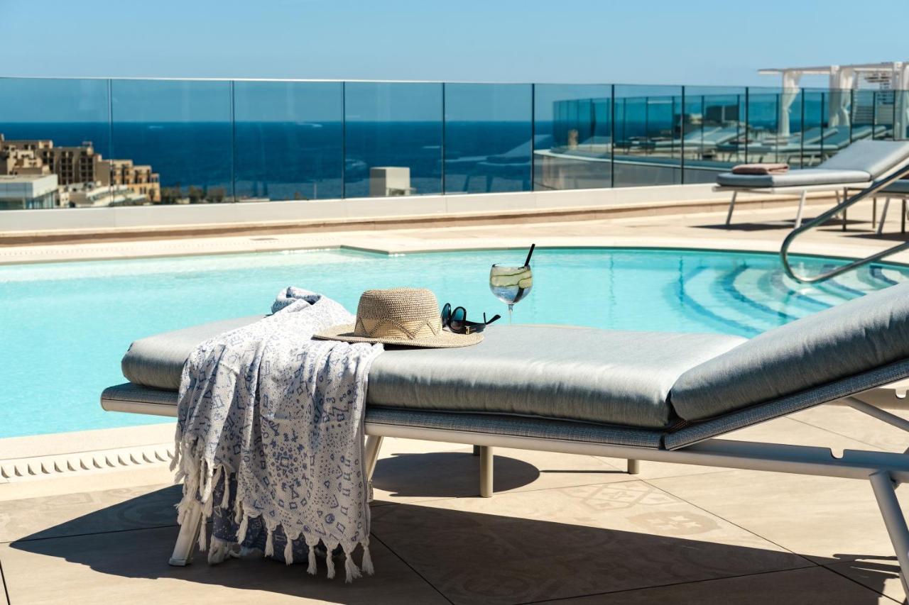 Hyatt Regency Malta Hotel Saint Julian's Exterior photo A Turkish towel draped over a lounge chair